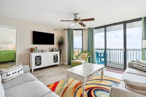 Another view of the living room with a smart TV and access to the oceanfront balcony