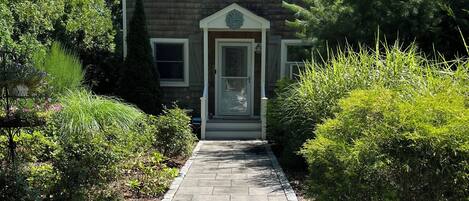 The entrance to the house is welcoming and the foliage inspiring.