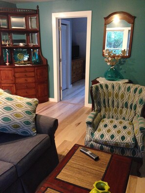 Bedroom door. Beautiful antique furniture is spread around the unit.