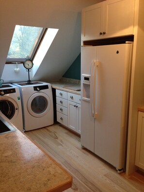 New kitchen and appliances, beautiful natural lighting from skylight.