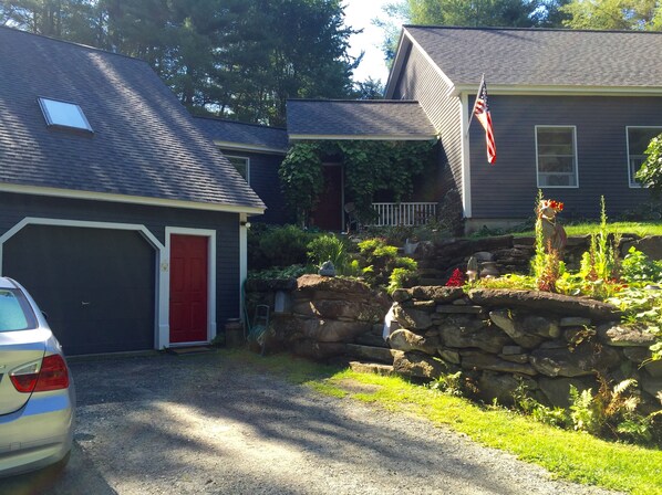 Outdoors always nicely maintained.  Apt is above garage on left side.