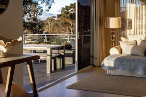 Main room looking out to alfresco dining on waterfront deck