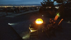 Enjoy sitting beside the Firepit at night with the city lights below. 