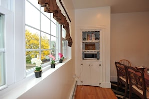Large window lets a lot of light into the kitchen.
