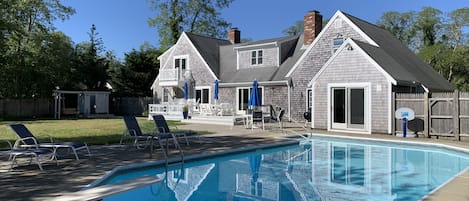 Full view of backyard with in ground pool