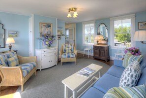 The family room connects to the indoor spaces, kitchen, and outdoor decks