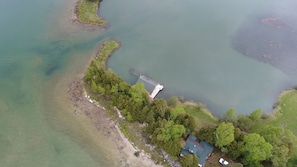 Updated Boathouse above and the cottage below in this aerial picture.