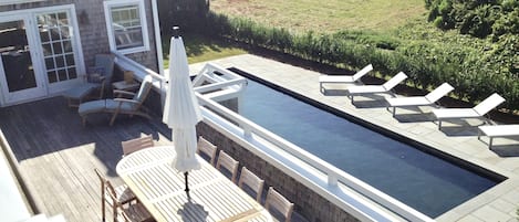 view of the pool from the second story deck