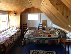 2nd floor bedroom with full bed, 2 built in cots, and a lake view.