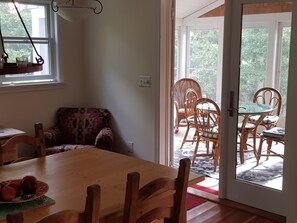 View to three season porch from dining room.