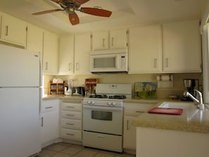 Airy kitchen with great mountain views and door to the patio