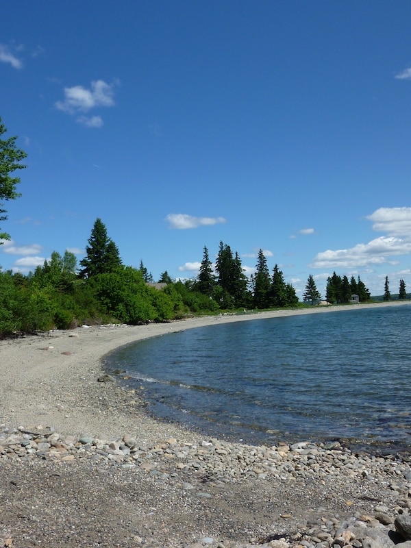 Our shorefront property includes our private beach, directly across the street.