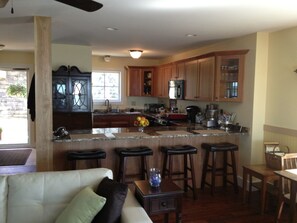 View of the kitchen with seating around the peninsula.