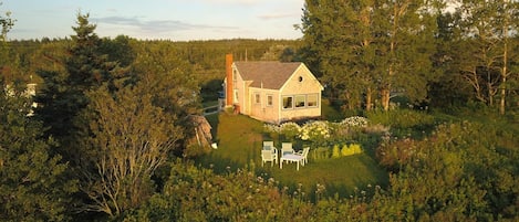 The cottage is in a small village, yet has a private lawn overlooking the ocean.