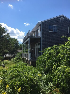 Large New England Shingle Colonial with multi decks and large lush private yard.