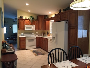 Kitchen with filtered water and ice maker in refrigerator. 