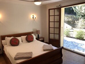 Main double bedroom with access to garden and terrace.