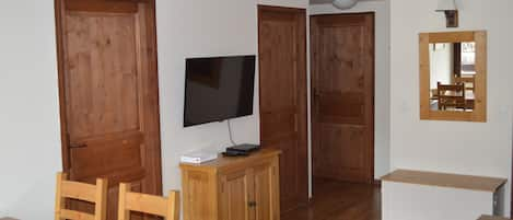 Living area looking into apt - doors in photo lead to bedrooms and bathroom.
