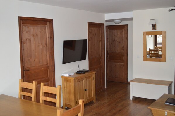 Living area looking into apt - doors in photo lead to bedrooms and bathroom.
