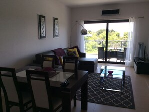 Spacious open plan living leading to sunny balcony overlooking the estuary 
