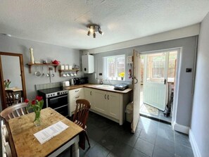 Kitchen with door to utility area