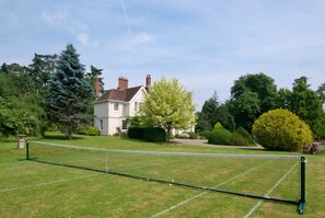 Summer tennis lawn at the Manor House