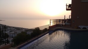 The pool and veranda at dawn - notice the Romeo and Juliet balcony which leads o