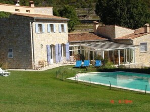 Large grassy garden around the pool