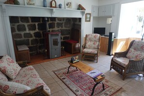 Living room with the 'cantou' fireplace.