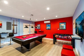 fabulous game room with pool, air hockey and foosball