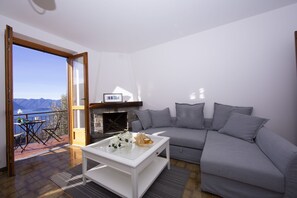 Living room and dining area with view of the lake