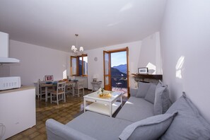 Living room and dining area with view of the lake