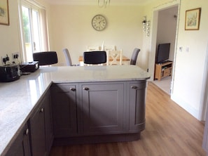 Kitchen with dishwasher, fridge freezer, double oven and ceramic hob