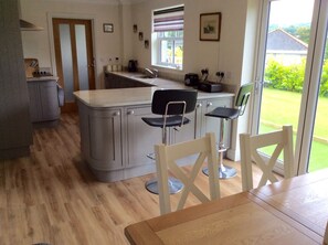 Dining area with bifold doors onto patio area