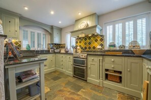 Ground floor: Kitchen with hand painted cupboards and granite worktops