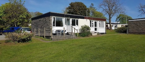 West Facing Chalet with terrace, open space in front and parking alongside