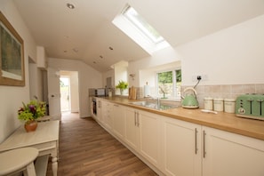 The Kitchen, airy and fully equipped plus utility area as you enter.