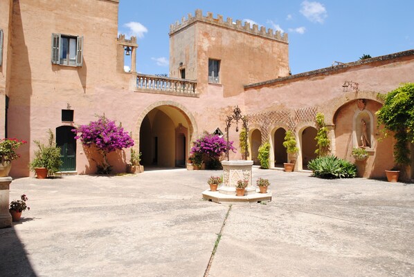 The courtyard with a well in the centre