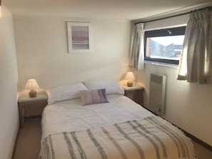 Master bedroom with wardrobe and chest of drawers and view of mountain