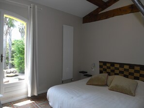 The bedroom with a big bed of 180 x 200 and two separate mattresses.