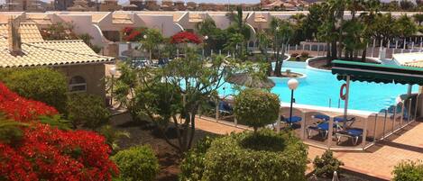 view of winter heated pool from upstairs balcony