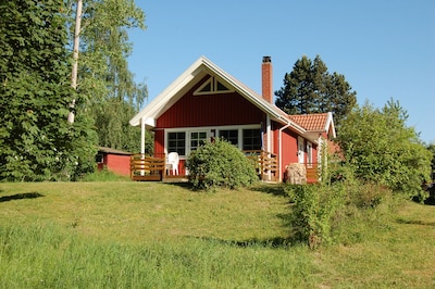 Sweden house in a quiet location directly on the lake with its own beach and jetty