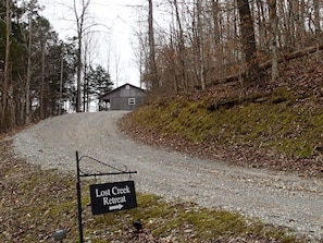 Welcome to Lost Creek Retreat.  Gravel driveway leading to home.