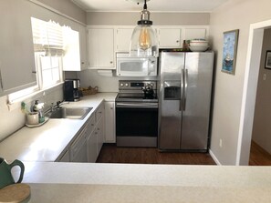 Kitchen with thru pass into living room