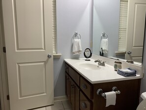 Master bathroom with hair dryer.