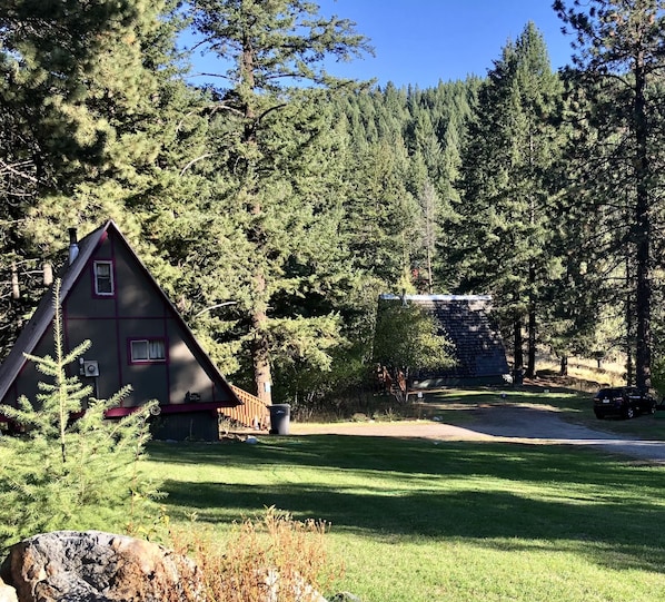 Private mountain retreat on two acres of riverfront property. 