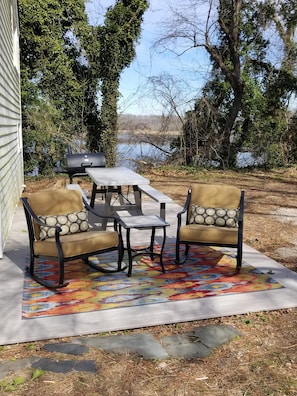 Patio/Deck with comfy seating, picnic table and grill.