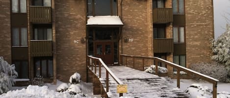 Winter view of the front entrance to the condo from the parking lot.