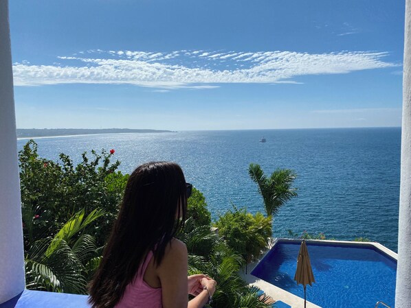 Pacific ocean view from balcony, and the infinity pool in front. 