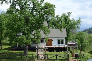 Enjoy seclusion amongst the ancient oaks while overlooking the creek